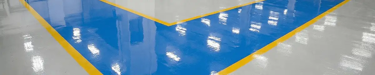 A factory floor professionally covered and marked with epoxy flooring in Huntsville, AL