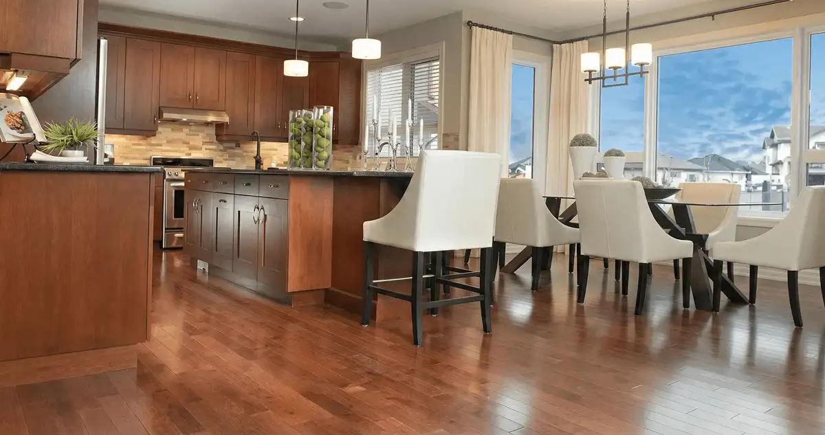 A modern kitchen with professionally installed wood flooring in Huntsville, AL