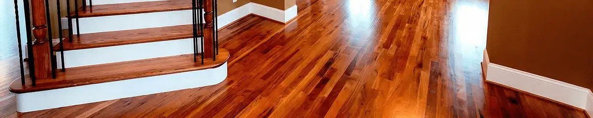 Base floor of a staircase with professionally restored wood flooring in Huntsville AL