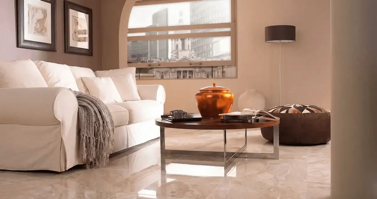 Modern living room with professionally installed marble flooring, a beige sofa, coffee table in Huntsville, AL