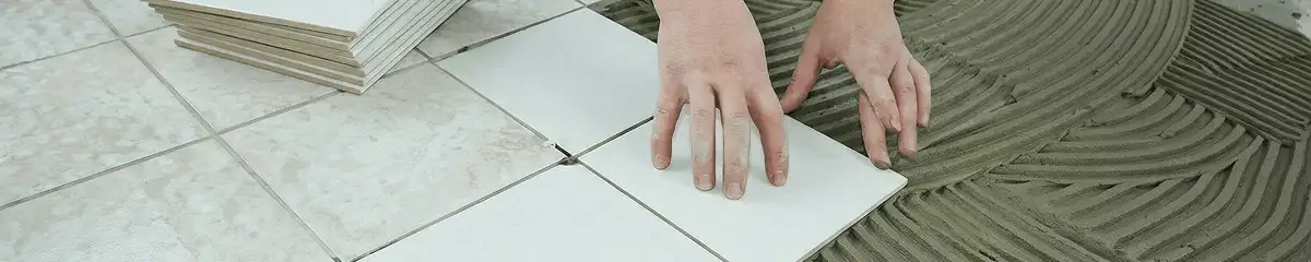 Professional installing white tile floors in Huntsville, AL