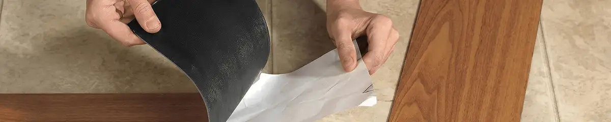 A professional installing vinyl flooring in Huntsville, AL